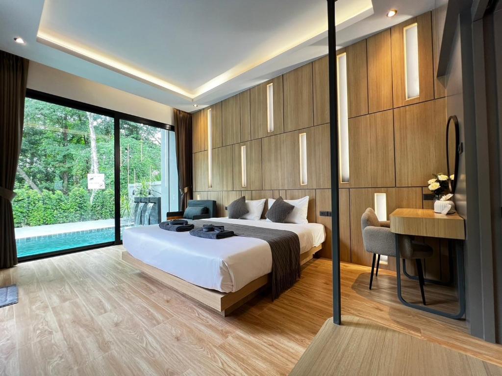 Ένα ή περισσότερα κρεβάτια σε δωμάτιο στο Riverla Villa