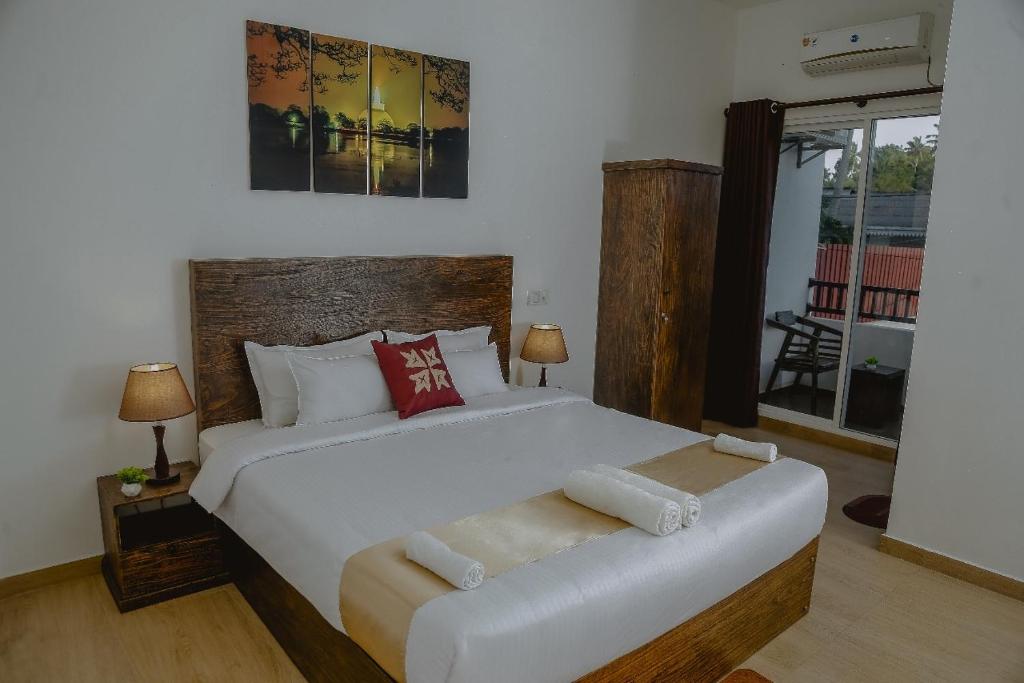 Postel nebo postele na pokoji v ubytování Lucky Transit Hotel - Katunayake Airport