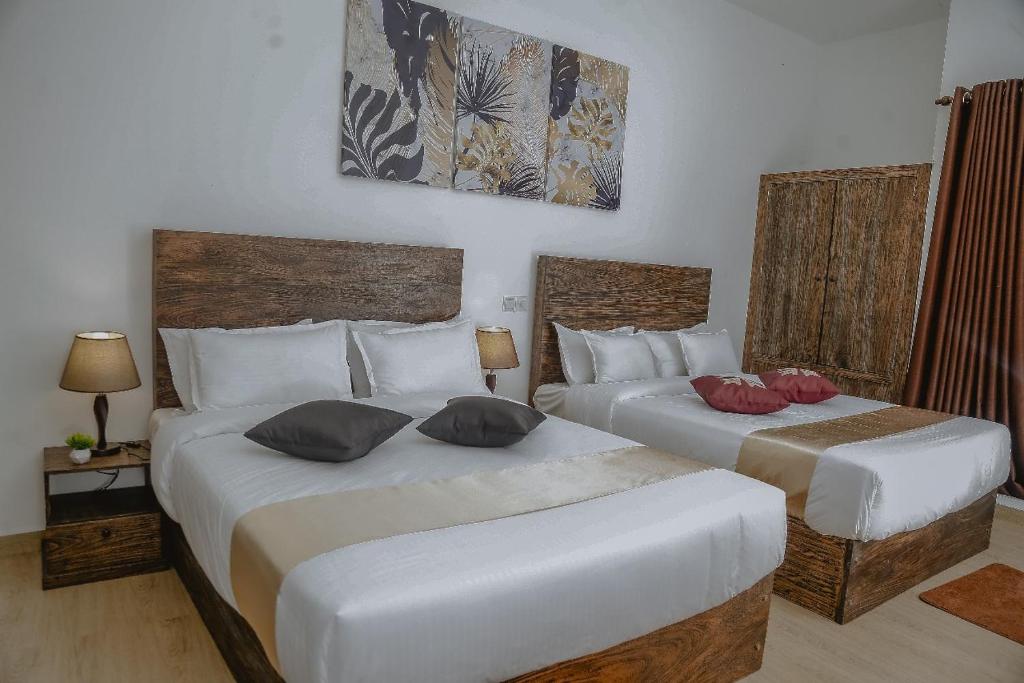 Postel nebo postele na pokoji v ubytování Lucky Transit Hotel - Katunayake Airport