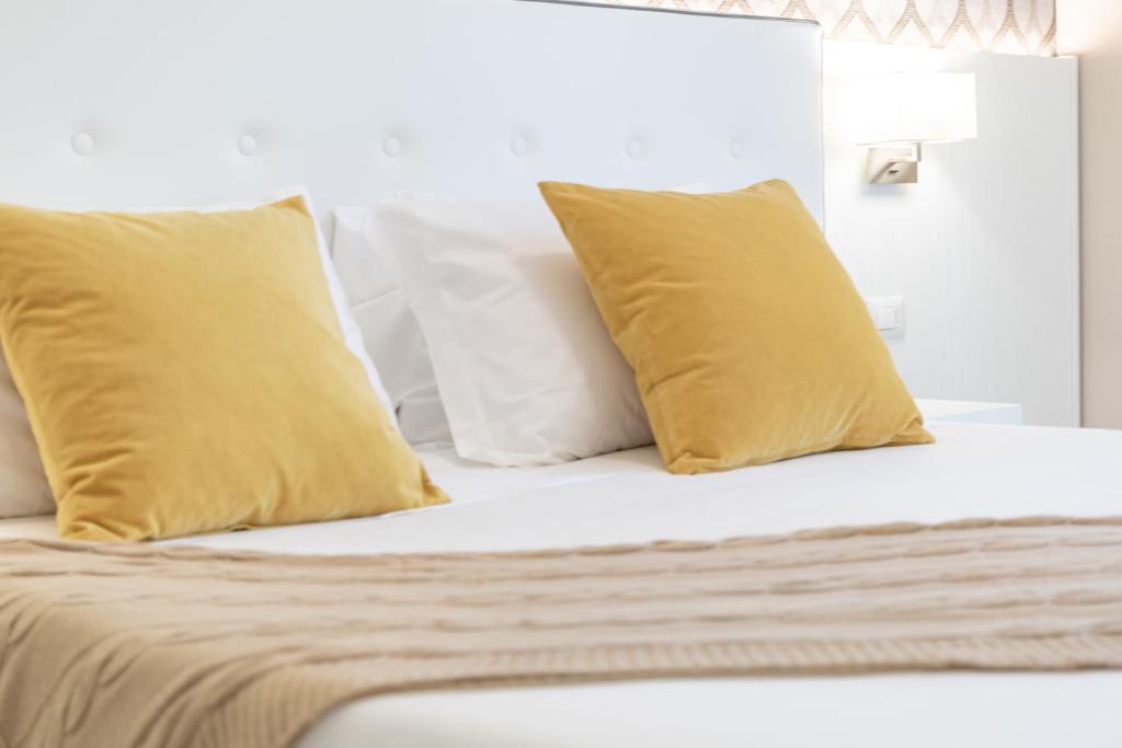 Postel nebo postele na pokoji v ubytování Hotel Biancamano