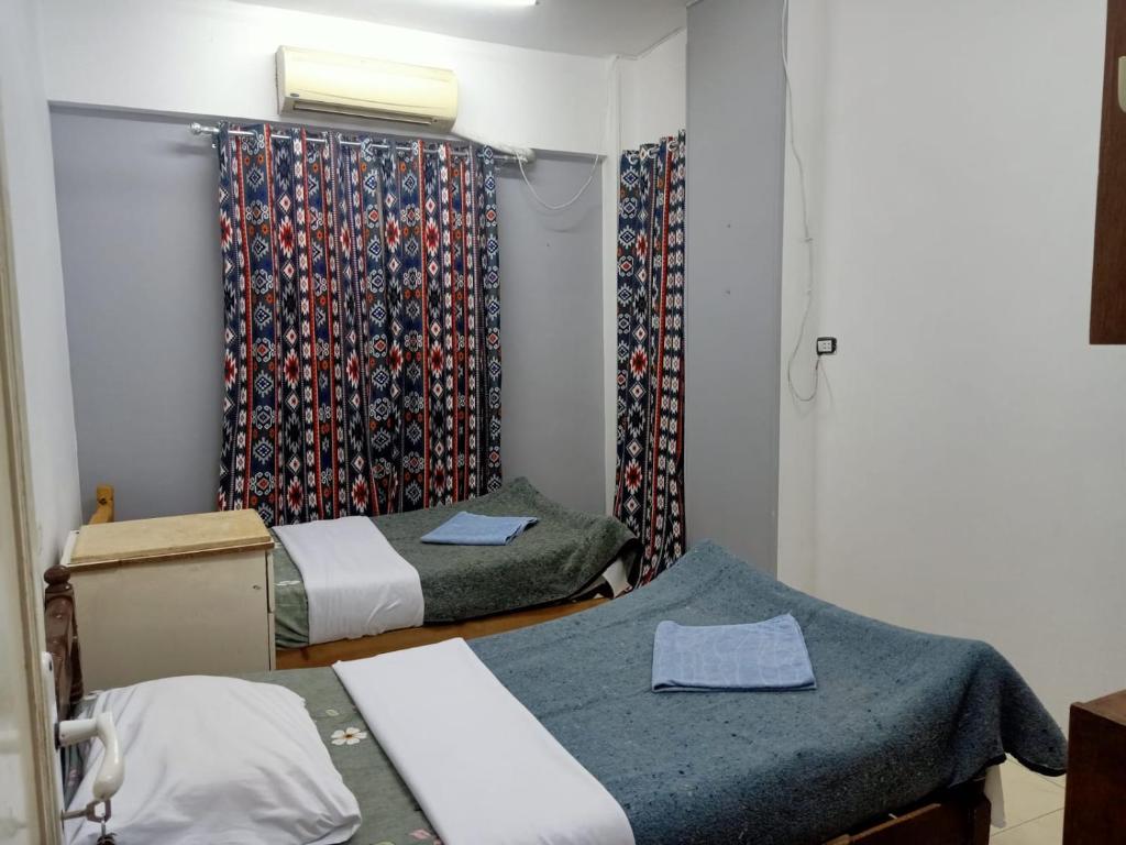 Postel nebo postele na pokoji v ubytování david hostel