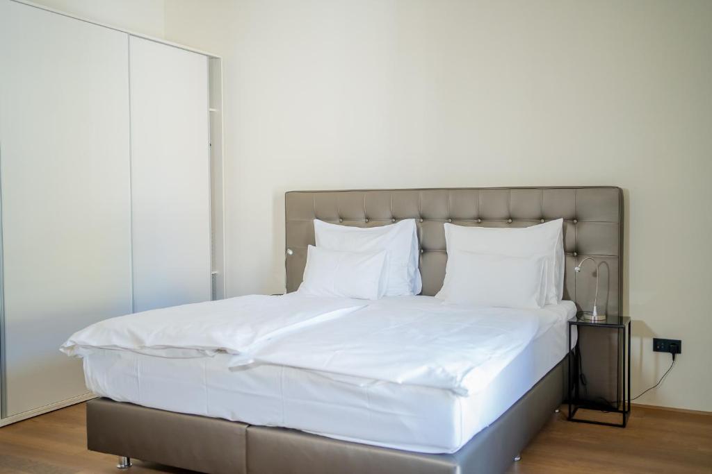 Voodi või voodid majutusasutuse Hotel Maribor, City apartments toas