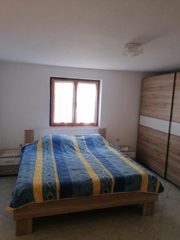 Postel nebo postele na pokoji v ubytování Apartments Olgi