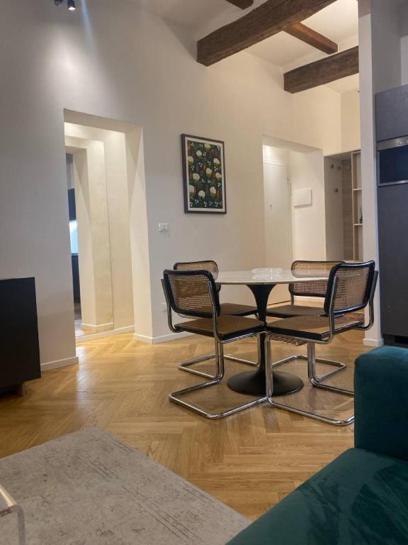 a dining room with a table and two chairs at La Nicchia in Bologna