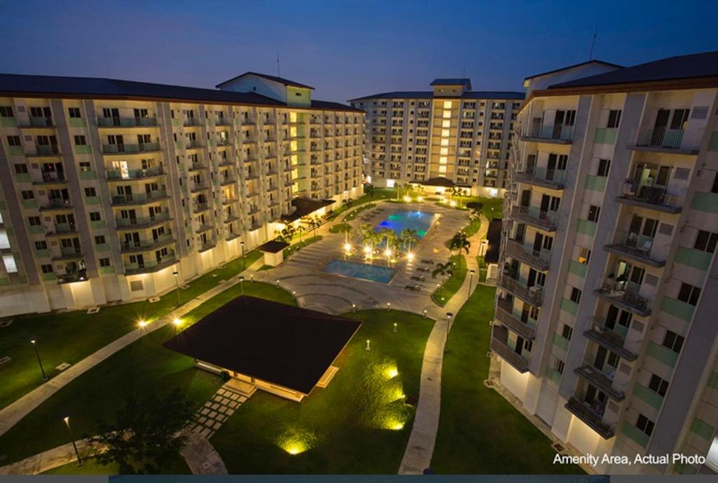 an overhead view of a courtyard with a pool and buildings at Jazz Cozy Abode in Manila