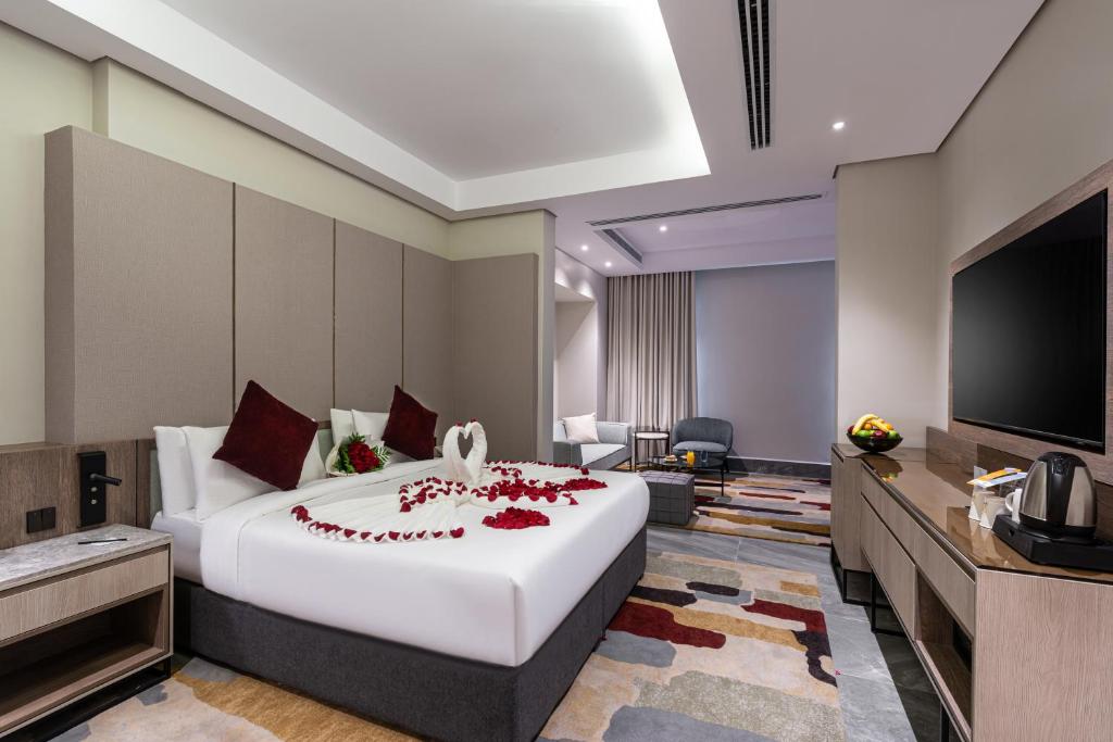 Postel nebo postele na pokoji v ubytování Ewaa Express Hotel - Abha