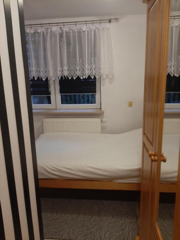 Posteľ alebo postele v izbe v ubytovaní Zielone Zacisze