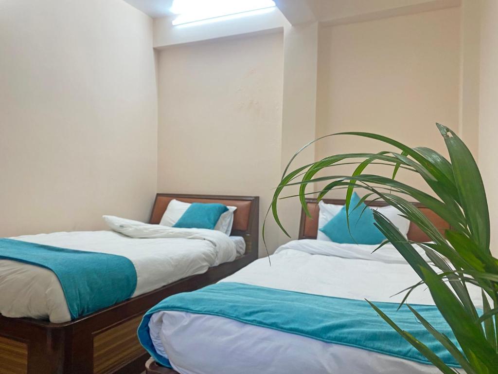 Voodi või voodid majutusasutuse Hotel Resunga Arjun toas