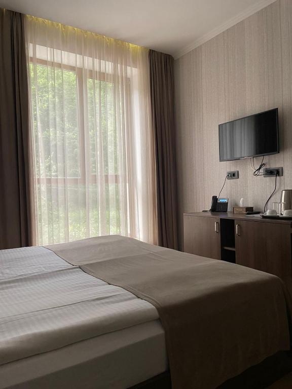 Postel nebo postele na pokoji v ubytování Marrone Hotel Tsaghkadzor