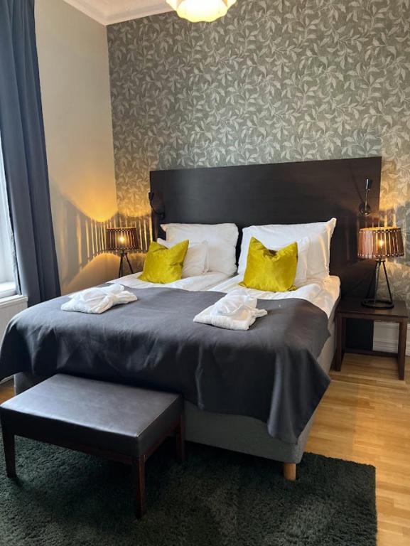 Postel nebo postele na pokoji v ubytování Home Hotel Plaza