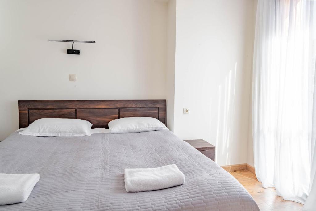 Postel nebo postele na pokoji v ubytování 2-room apartment New Gudauri F1