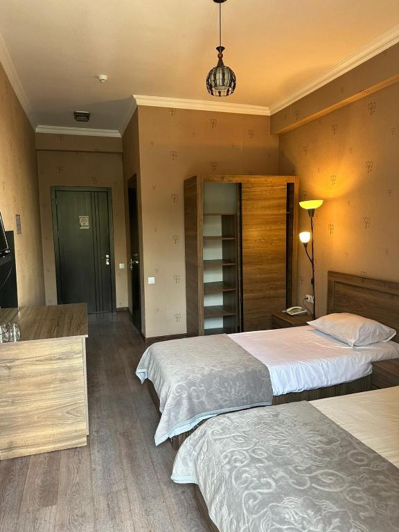 Postel nebo postele na pokoji v ubytování Hotel Nirvana