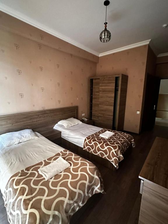 Postel nebo postele na pokoji v ubytování Hotel Nirvana