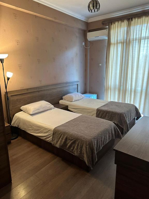 Postel nebo postele na pokoji v ubytování Hotel Nirvana