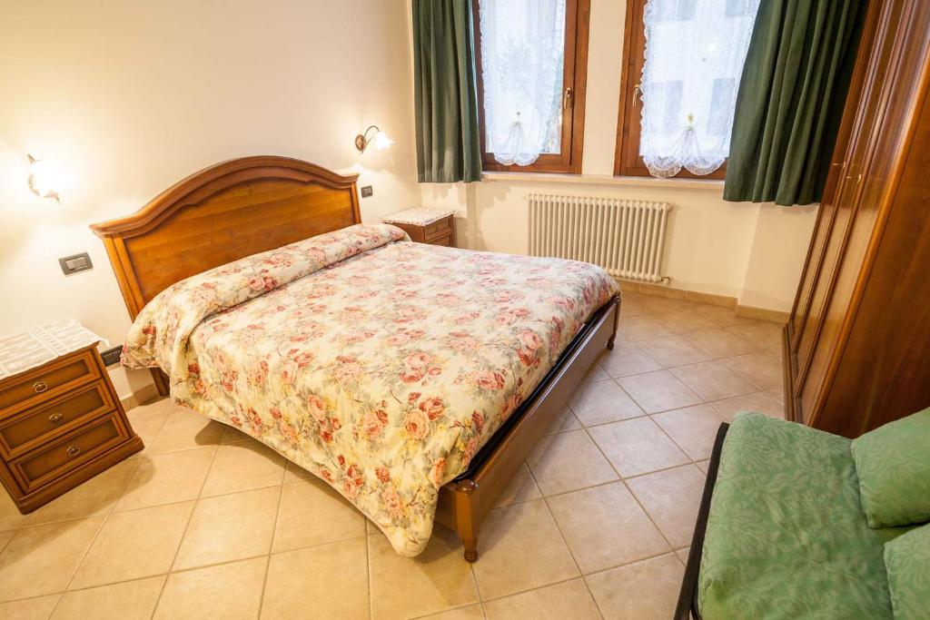 Postel nebo postele na pokoji v ubytování Agriturismo Ai Tre Fienili