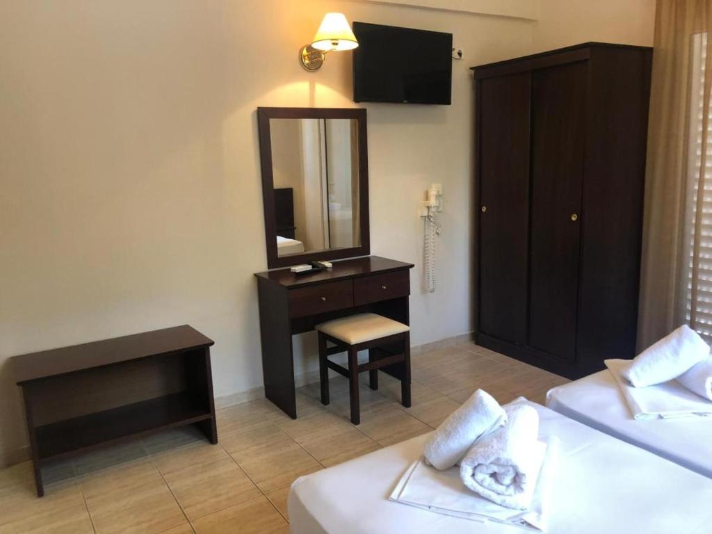 Postel nebo postele na pokoji v ubytování Hotel Paradise