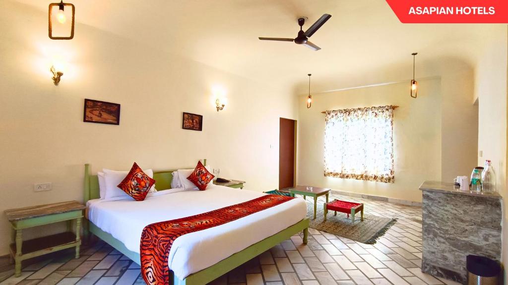 Postel nebo postele na pokoji v ubytování Anantvan Ranthambore By Asapin Hotels