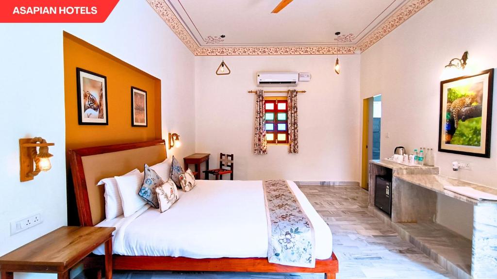 Postel nebo postele na pokoji v ubytování Anantvan Ranthambore By Asapin Hotels