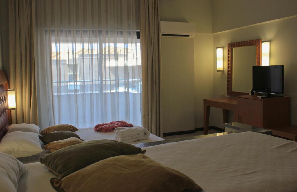 Postel nebo postele na pokoji v ubytování Scylax Hotels Mahmutlar