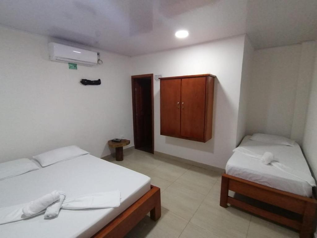 Postel nebo postele na pokoji v ubytování Hotel Glorial
