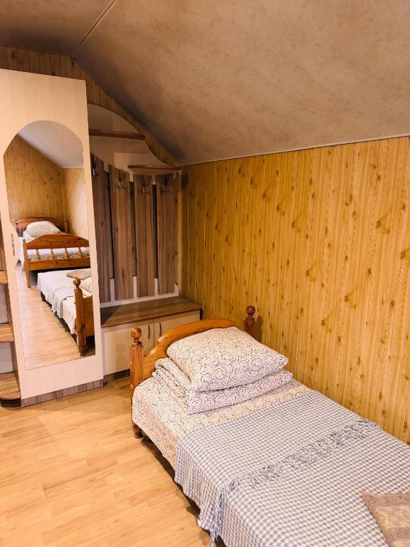 Postel nebo postele na pokoji v ubytování Pid Yavorom