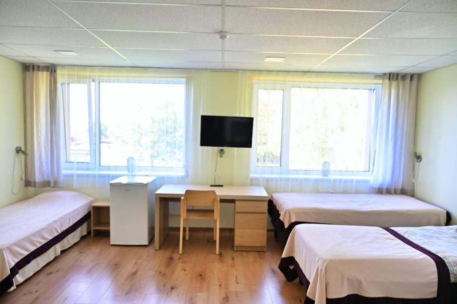 Postel nebo postele na pokoji v ubytování Vinni Hostel