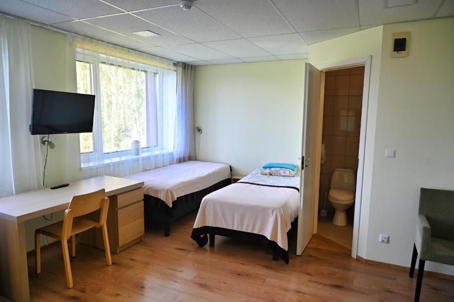 Postel nebo postele na pokoji v ubytování Vinni Hostel