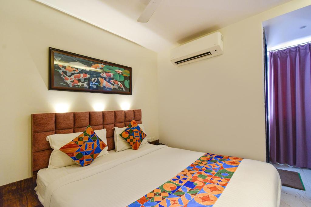 Postel nebo postele na pokoji v ubytování FabHotel Prime Prowell Apex - Nr KIMS Hospital, Hitech City