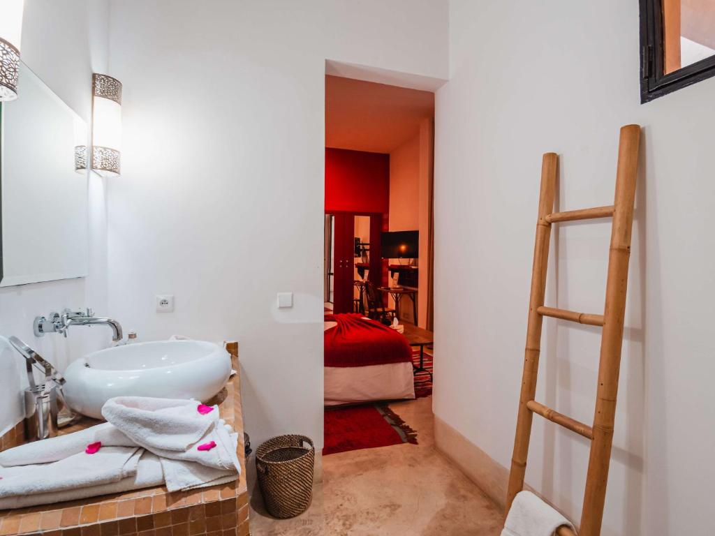 Postel nebo postele na pokoji v ubytování Riad la Source du Desert