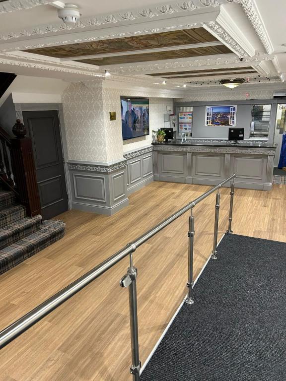 a large room with a dance floor and a stage at Britannia Hotel Birmingham New Street Station Birmingham in Birmingham