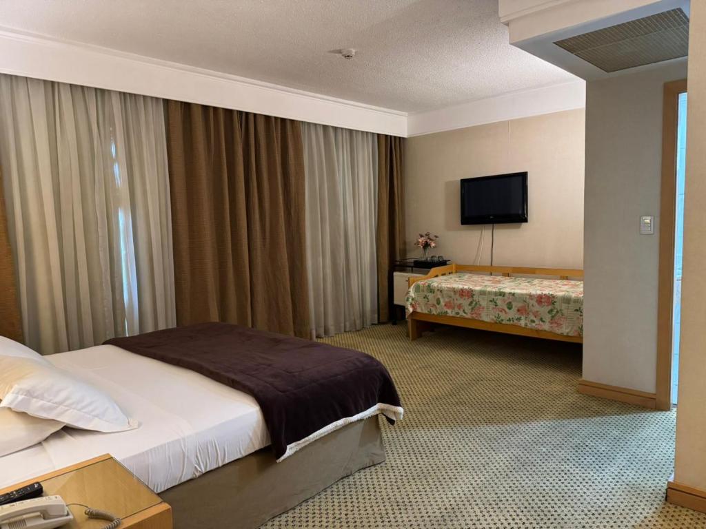 Postel nebo postele na pokoji v ubytování Flat Guarulhos - 2