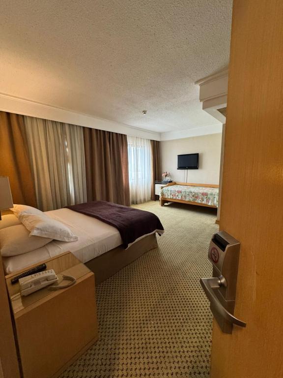 Postel nebo postele na pokoji v ubytování Flat Guarulhos - 2