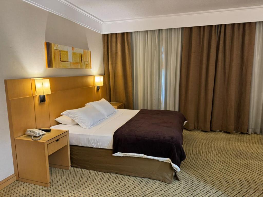 Postel nebo postele na pokoji v ubytování Flat Guarulhos - 2