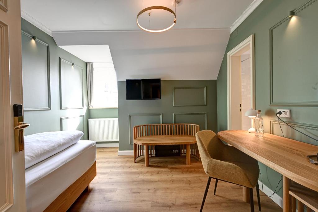 TV a/nebo společenská místnost v ubytování Hotel Uhland