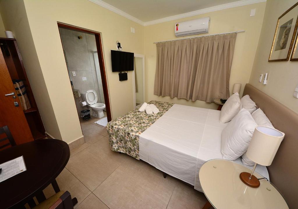 Postel nebo postele na pokoji v ubytování Hotel Passaledo
