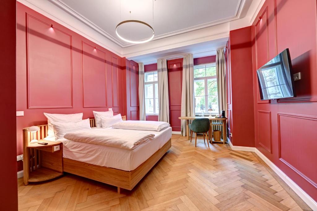 Postel nebo postele na pokoji v ubytování Hotel Uhland