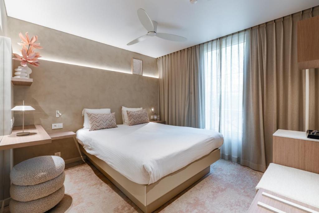 Cama o camas de una habitación en Hotel Astoria Gent