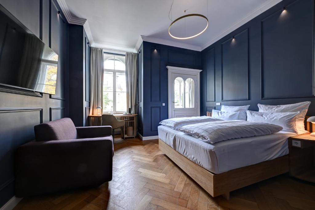 Postel nebo postele na pokoji v ubytování Hotel Uhland