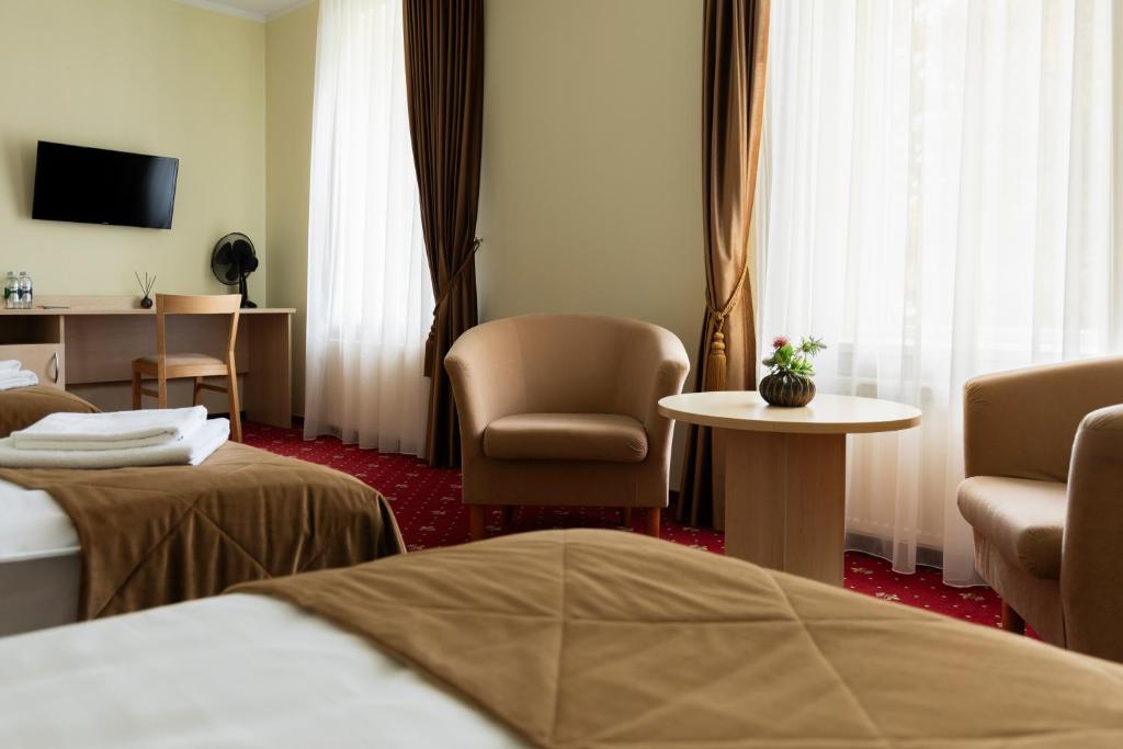 Postel nebo postele na pokoji v ubytování Domus Hotel