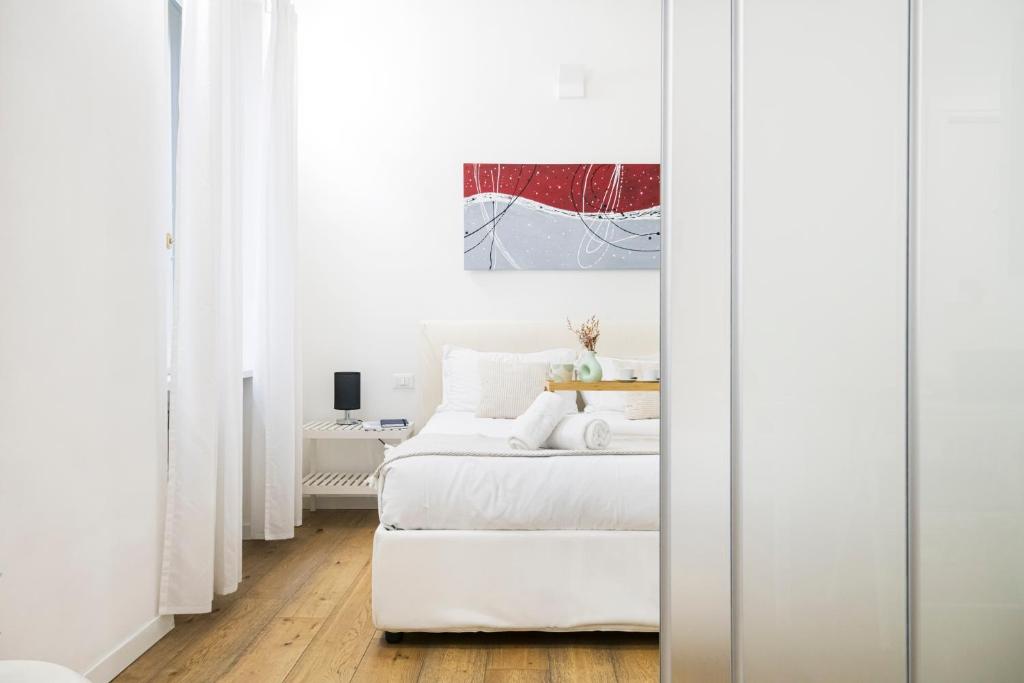 Łóżko lub łóżka w pokoju w obiekcie Amazing, new & fully furnished studio in Duomo