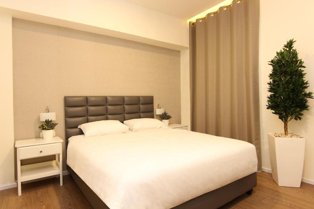Postel nebo postele na pokoji v ubytování Idelson Hotel