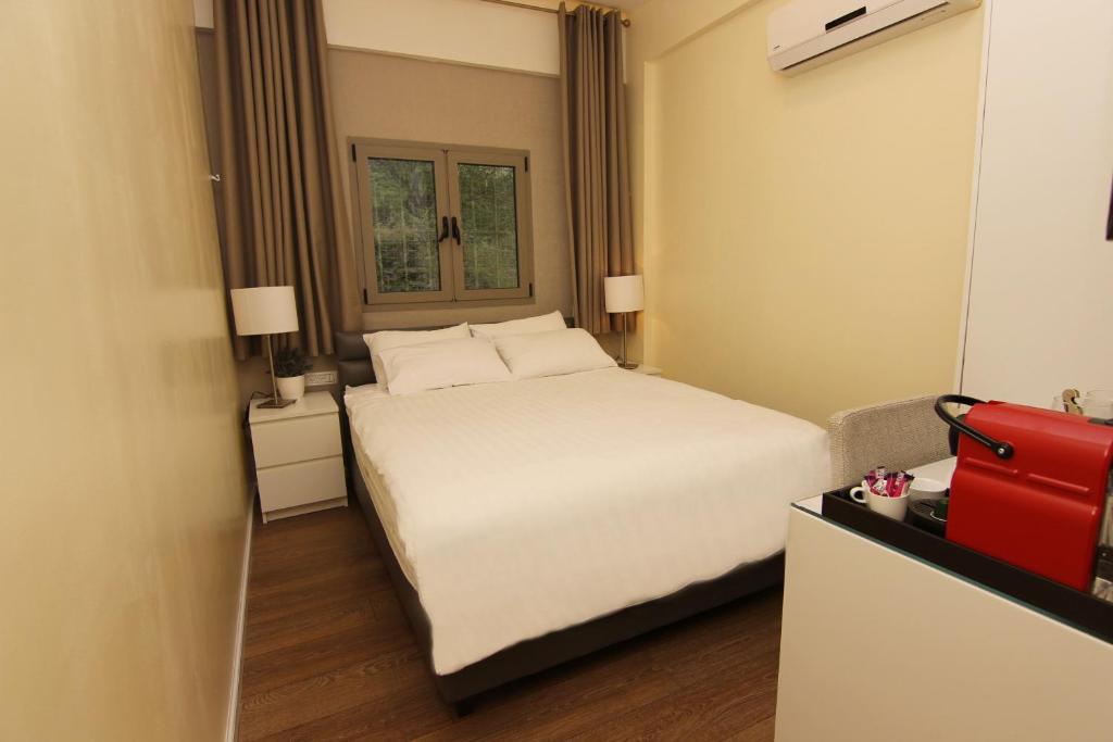 Postel nebo postele na pokoji v ubytování Idelson Hotel