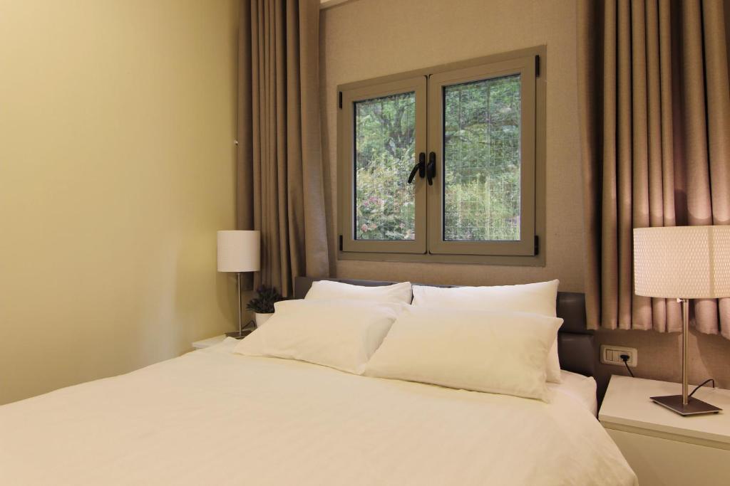 Postel nebo postele na pokoji v ubytování Idelson Hotel