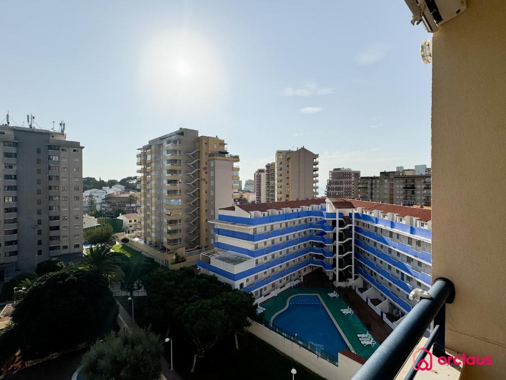a view of a city with tall buildings and a pool at La Marina in Oropesa del Mar
