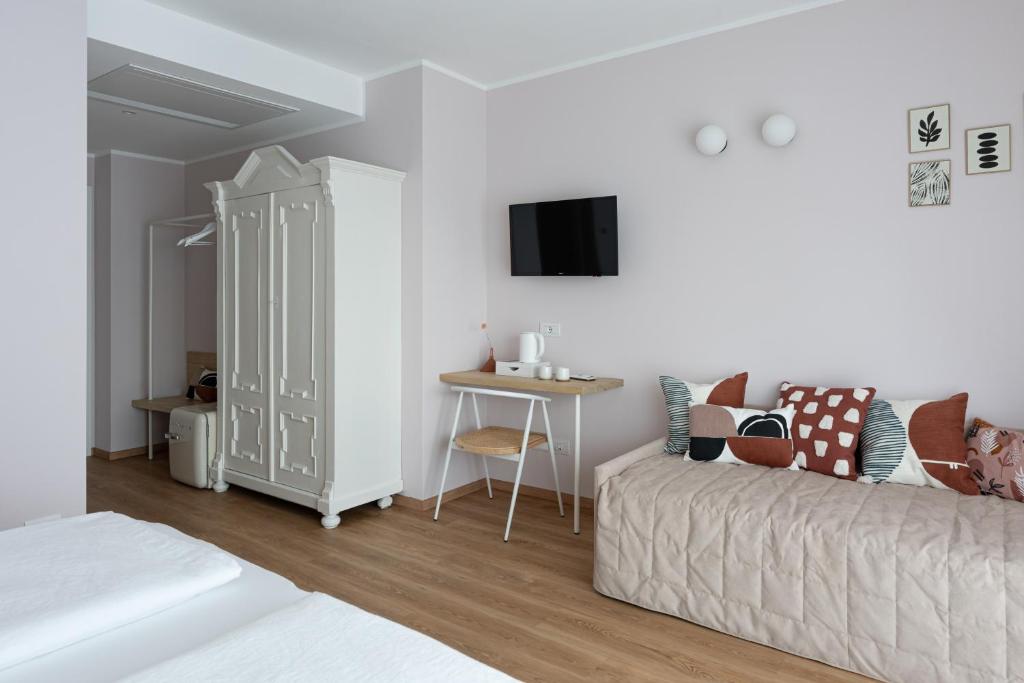 Postel nebo postele na pokoji v ubytování Hotel Trento Alta