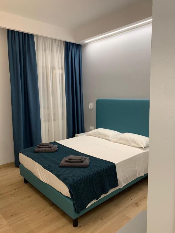 Postel nebo postele na pokoji v ubytování Fla Rooms