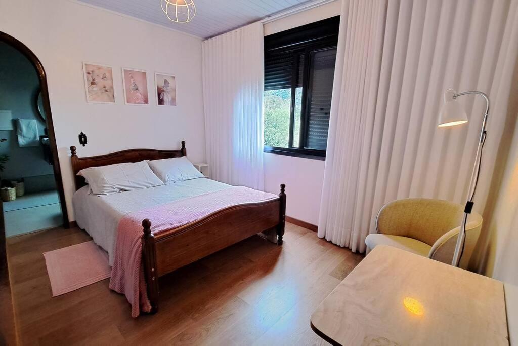 Postel nebo postele na pokoji v ubytování Casa na Serra Gaúcha com Lareira
