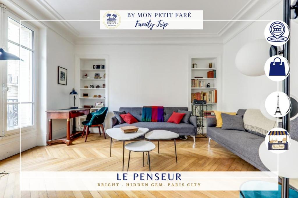 un salon avec un canapé et une table dans l'établissement Le Penseur - Lumineux & proche Tour Eiffel, à Paris