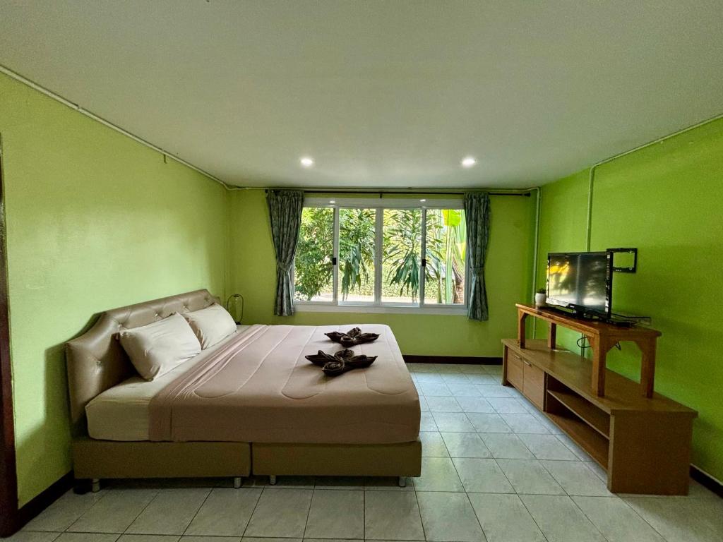 BAAN APA ERAWAN Resortにあるベッド