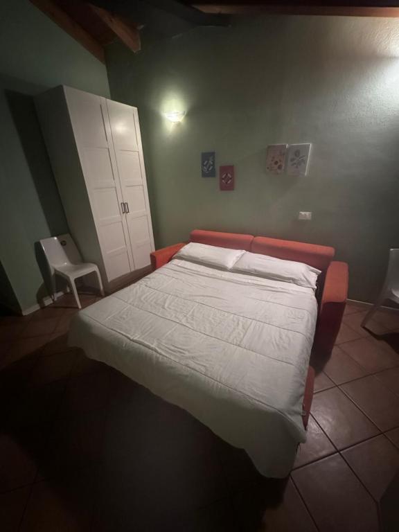 a bedroom with a bed and two chairs at Garibaldi 4 Loft in Brescia
